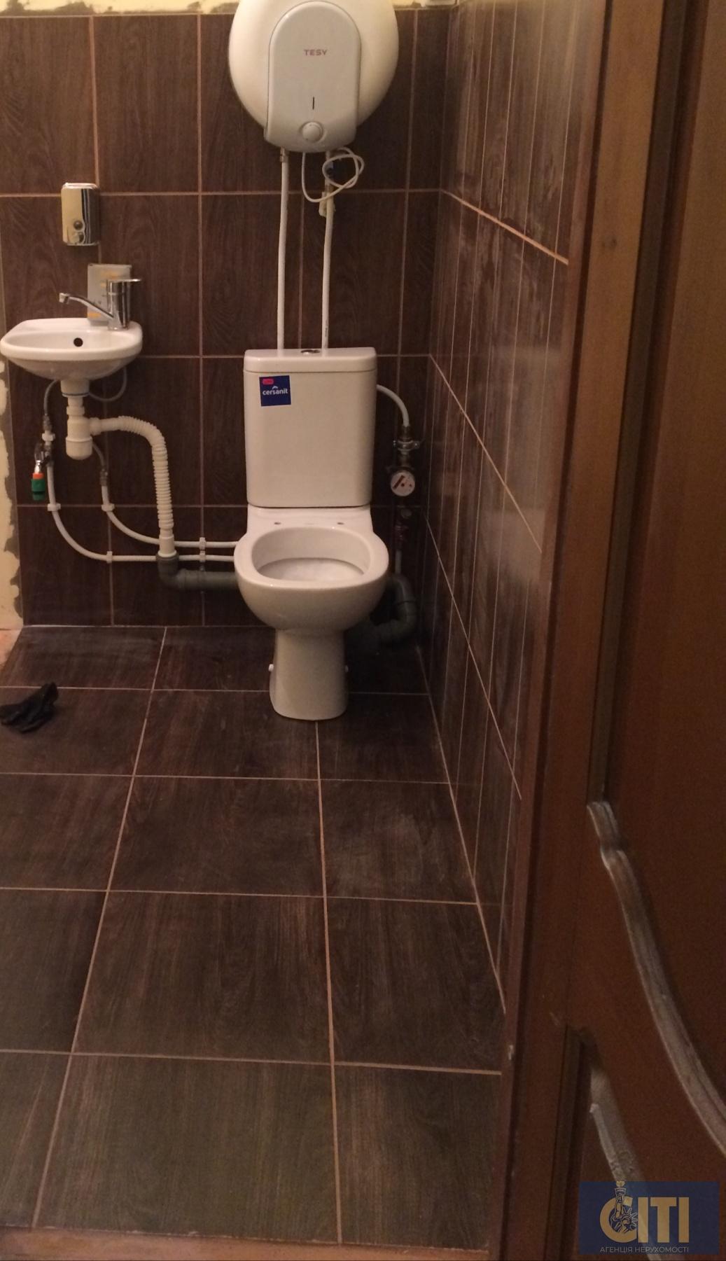 IMG-341f02b0960cd88542bd6123d1a2c2e6-V Будівля діючого магазину в центрі районного центру, 50 кв.м